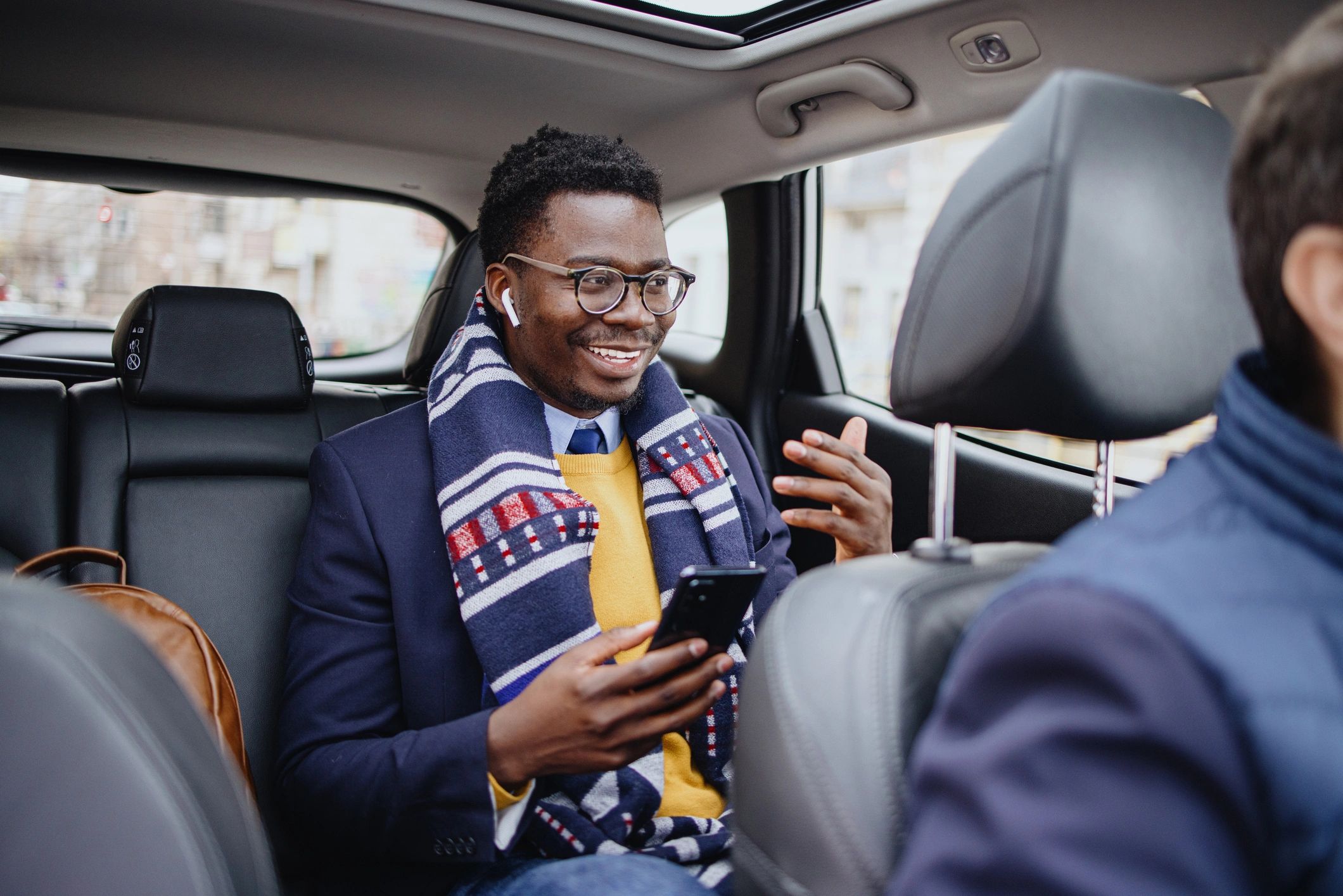 Professional passenger riding comfortably in a car service