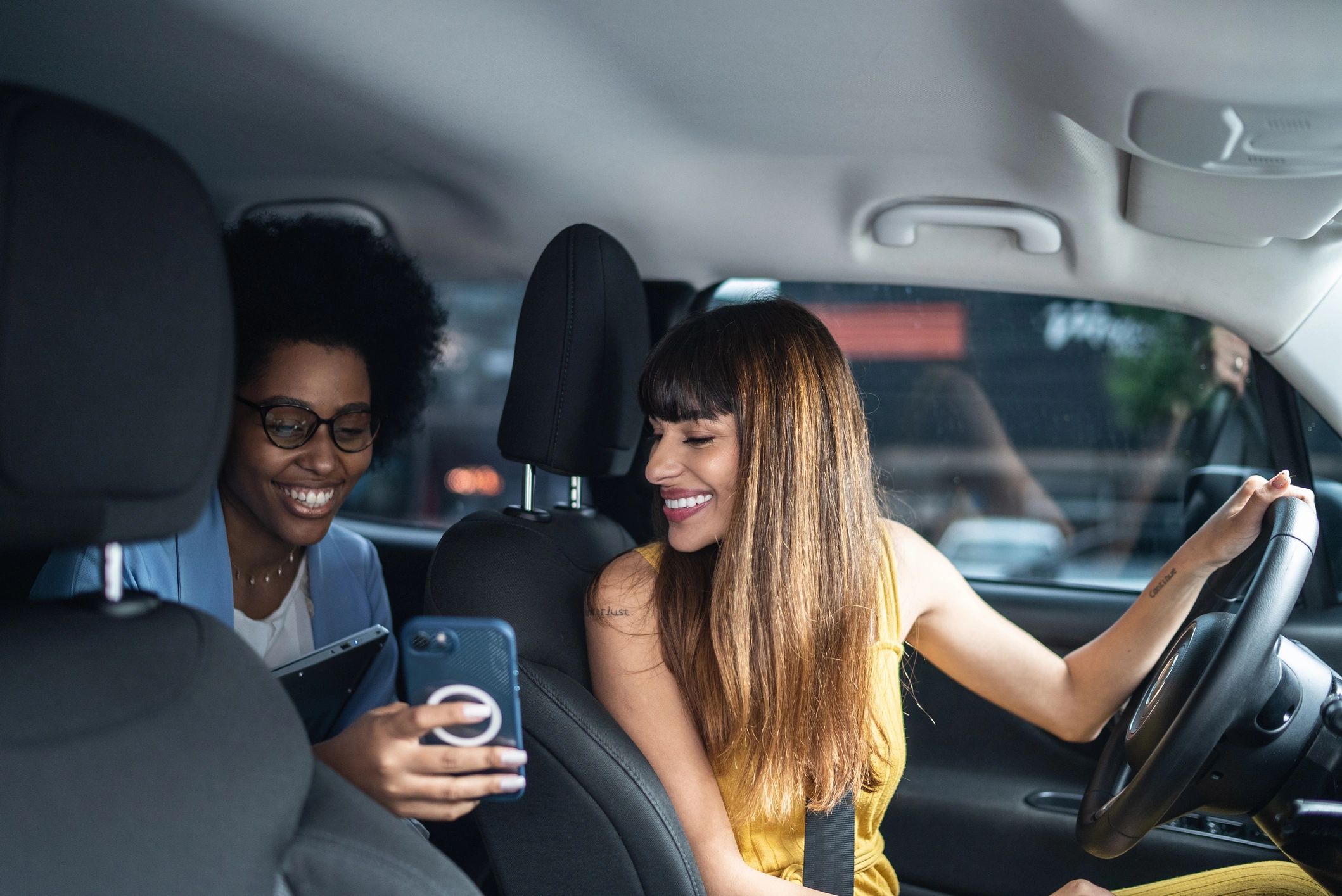Passenger speaking with a professional driver during pickup
